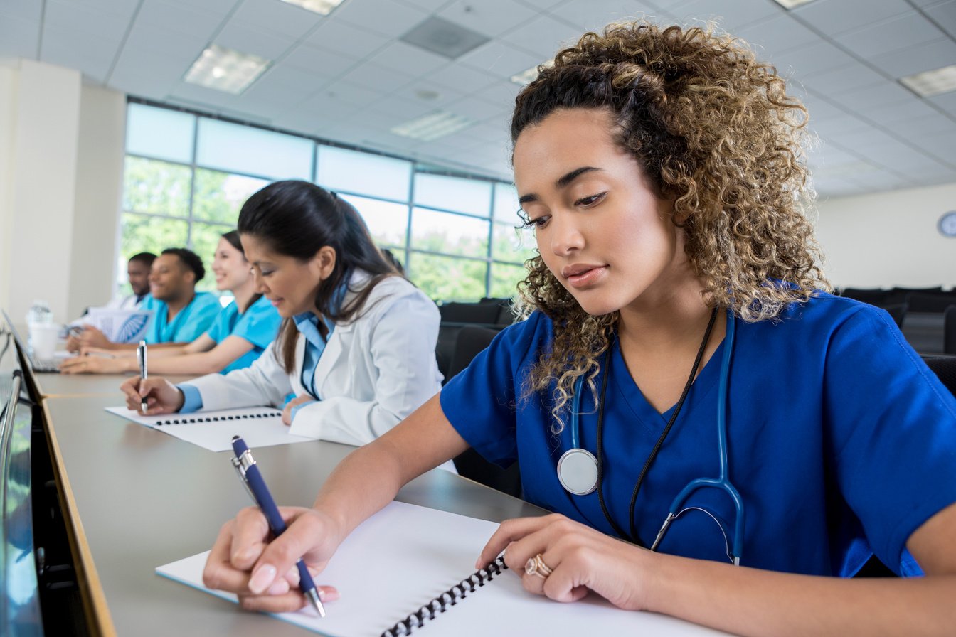 Focused nursing student studies for test