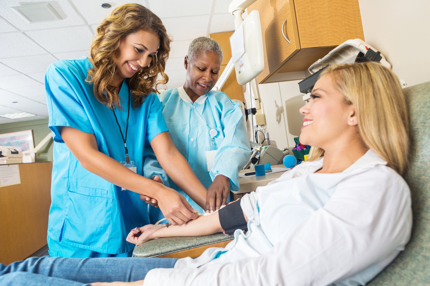 Nursing student learning to insert line for blood donation